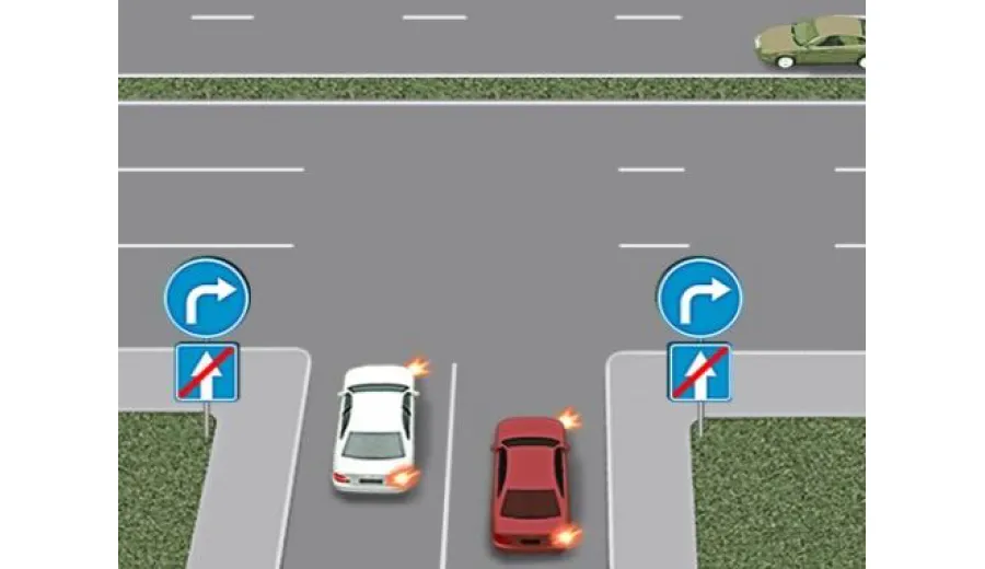 Is the driver who is on the left making a right turn correctly?