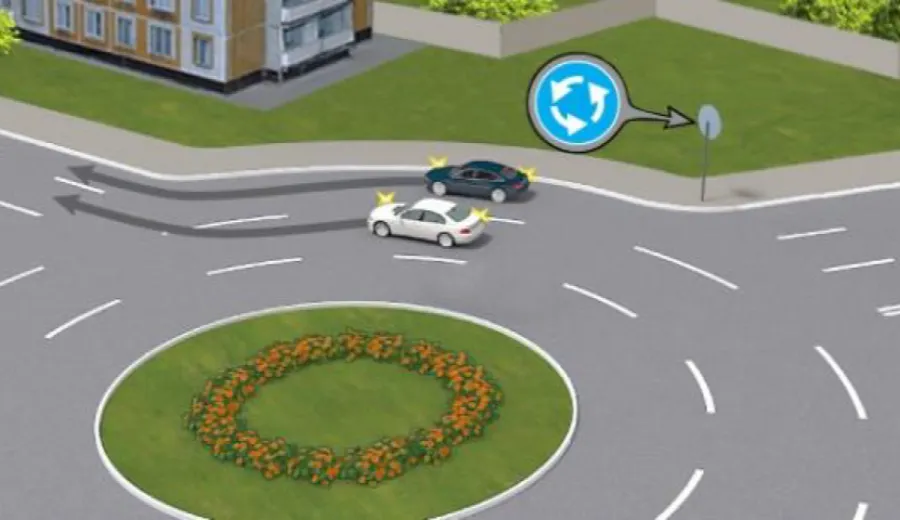 Did the driver of the white vehicle correctly exit the roundabout at the same time as the driver of the blue vehicle?