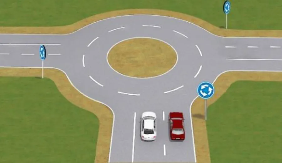 Which of the drivers has correctly chosen the lane for turning when entering an intersection with a roundabout?