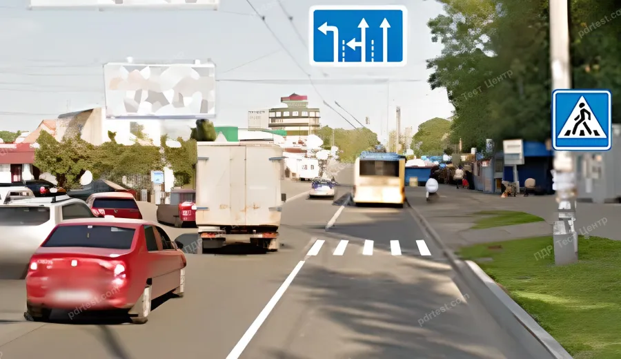 Is the driver of the red car allowed to proceed straight ahead in this situation?