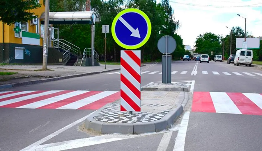 If a pedestrian crossing is divided by a safety island, is it permitted to make a U-turn at such a crossing?