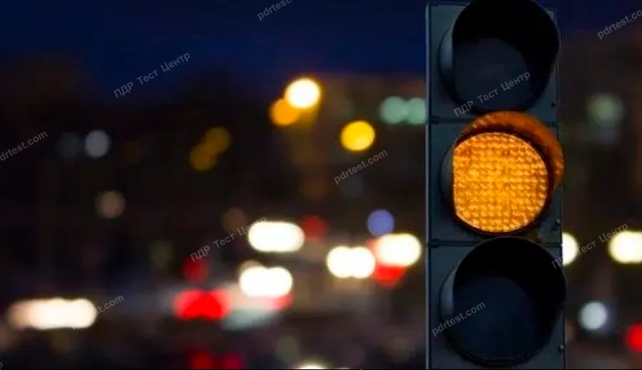 Should you follow the rules for passing uncontrolled intersections and the relevant road signs installed at the intersection if you approach a traffic light operating in the flashing yellow mode?