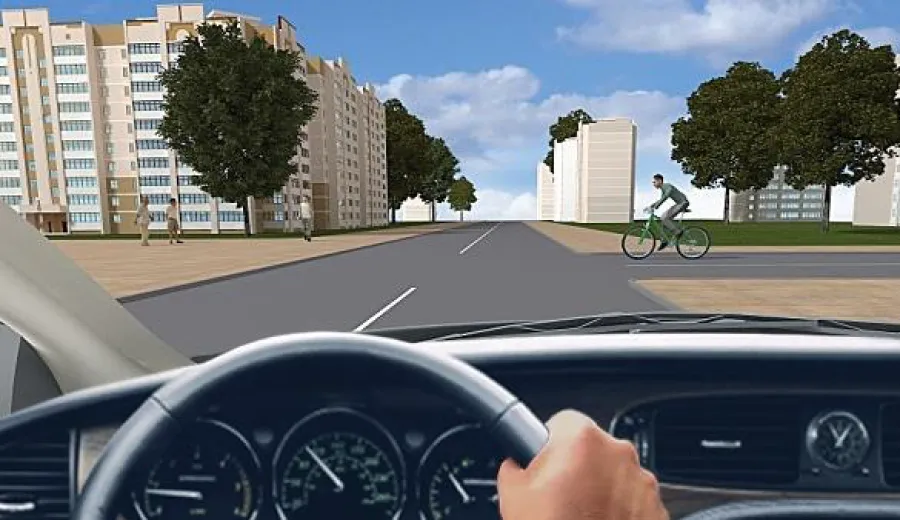 When driving straight at this intersection, you must: