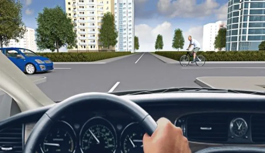 When driving through this intersection, you must: