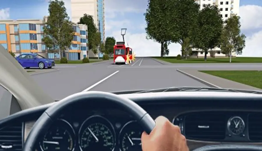 When driving straight at this intersection, you must: