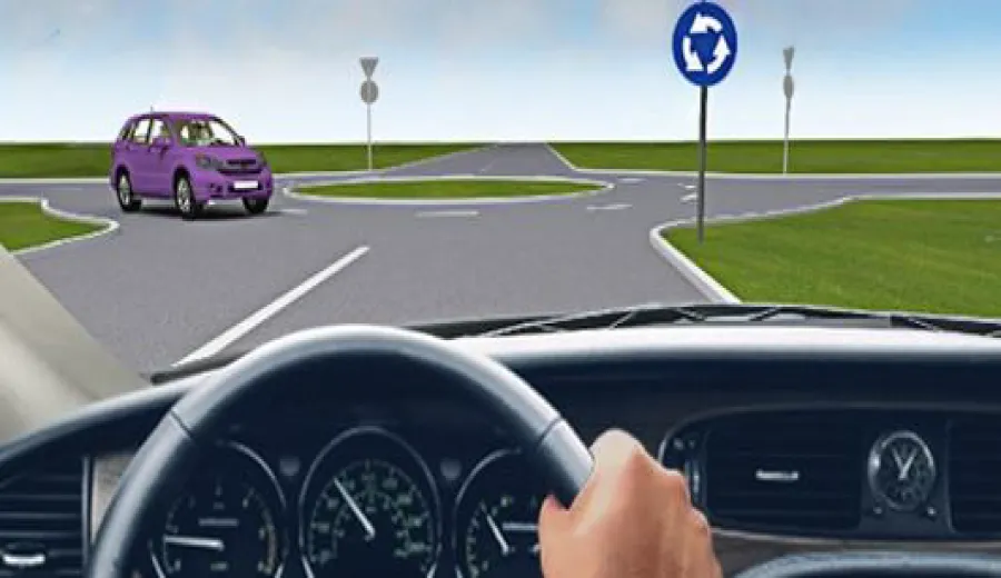 How should you proceed through this intersection?