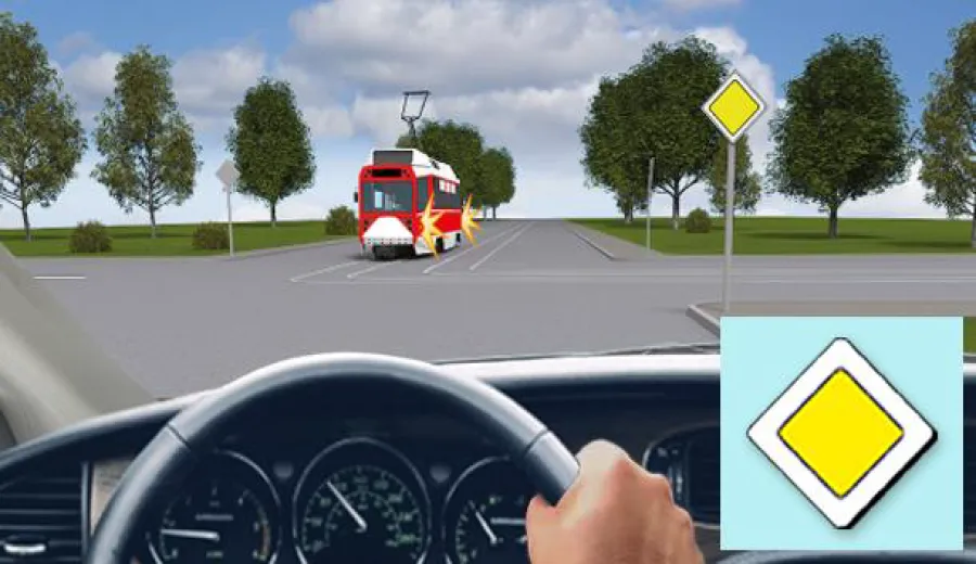 When driving straight at this intersection, you must: