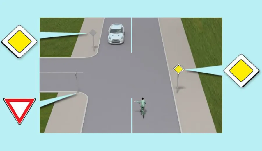 How will the cyclist, who is turning left, pass this intersection?