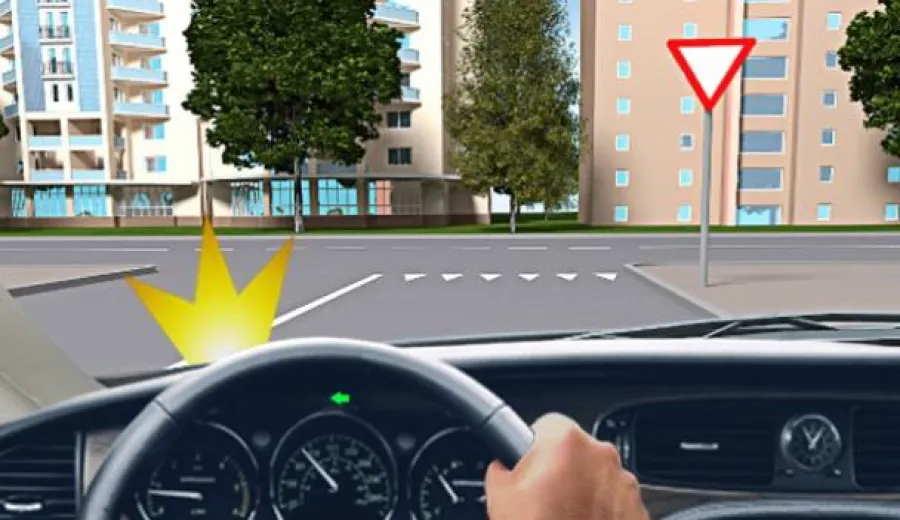 At which place must you stop to give way to vehicles on the intersecting road when turning left in this situation?
