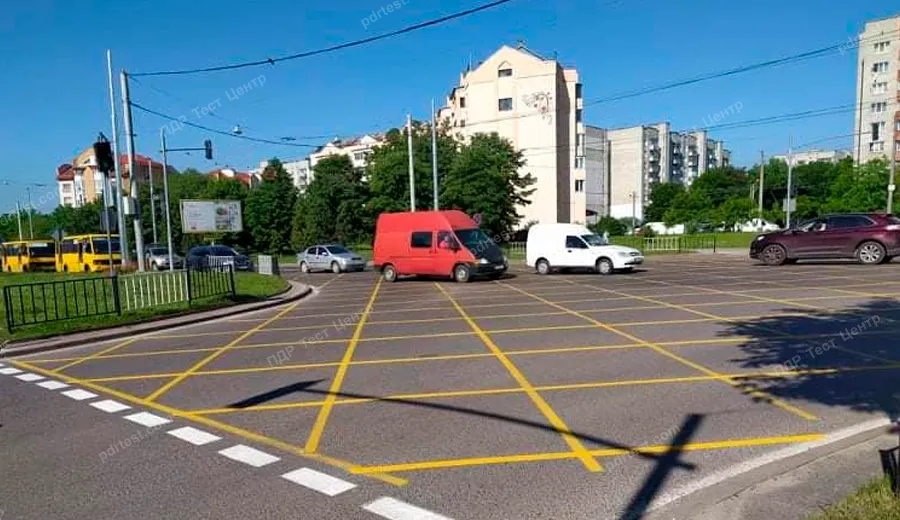 Does this horizontal road marking indicate areas at an intersection where it is prohibited to enter if there is a traffic congestion ahead?